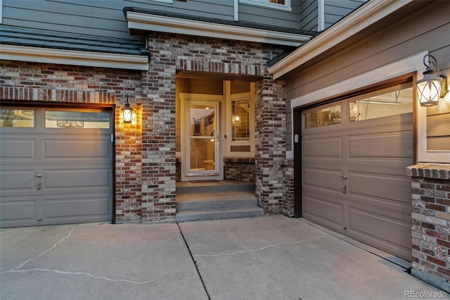 1609 S Catawba Cir, Aurora, CO 80018 - entrance to property featuring concrete driveway, brick siding, and a garage