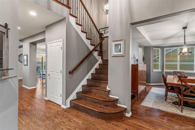 1609 S Catawba Cir, Aurora, CO 80018 - stairway with wood finished floors and a barn door