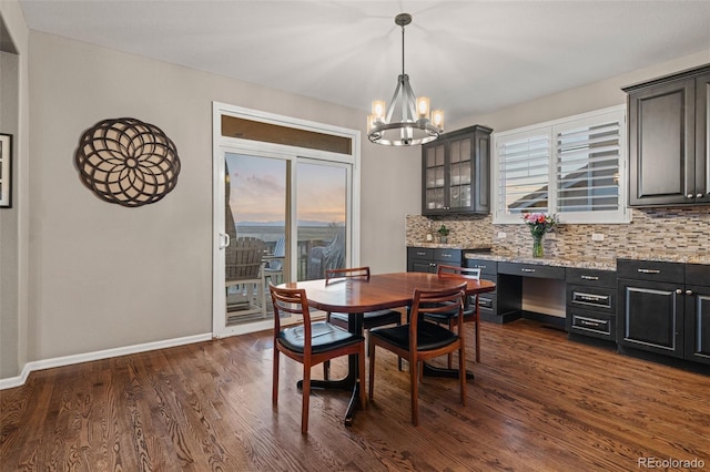 1609 S Catawba Cir, Aurora, CO 80018 - dining room featuring a chandelier, plenty of natural light, and dark wood finished floors
