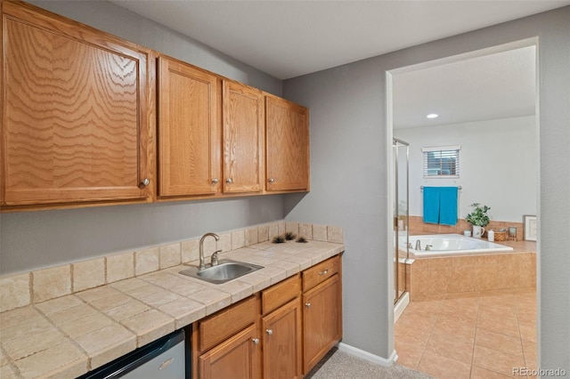 1609 S Catawba Cir, Aurora, CO 80018 - kitchen featuring stainless steel dishwasher, tile counters, and light tile patterned floors