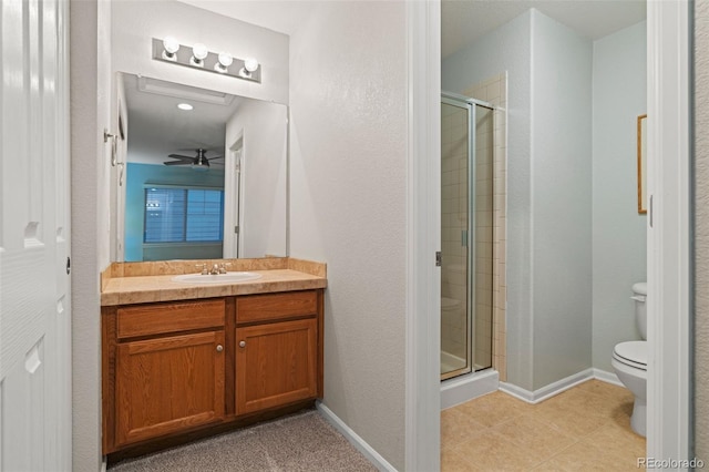 1609 S Catawba Cir, Aurora, CO 80018 - bathroom featuring a shower stall, vanity, and tile patterned flooring