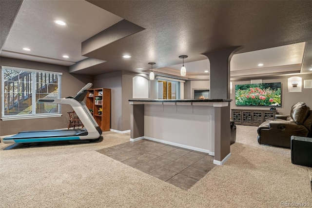 1609 S Catawba Cir, Aurora, CO 80018 - kitchen featuring carpet, a tray ceiling, recessed lighting, a textured ceiling, and open floor plan