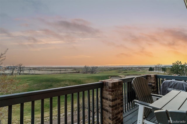 1609 S Catawba Cir, Aurora, CO 80018 - deck at dusk featuring a yard and a view of rural / pastoral area