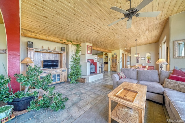 11855 County Road 251a, Salida, CO 81201 - living area with a ceiling fan, wooden ceiling, stone tile flooring, and a wood stove