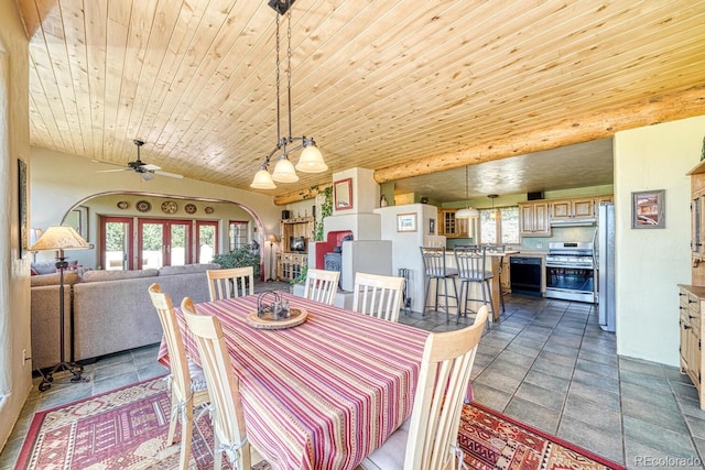 11855 County Road 251a, Salida, CO 81201 - dining area featuring plenty of natural light, a ceiling fan, wood ceiling, and arched walkways