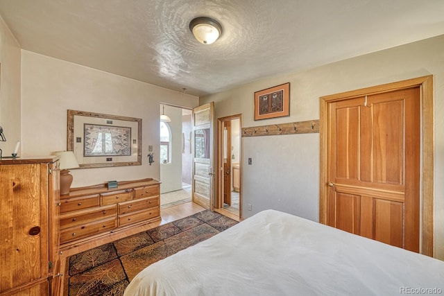 11855 County Road 251a, Salida, CO 81201 - bedroom with a textured ceiling and wood finished floors