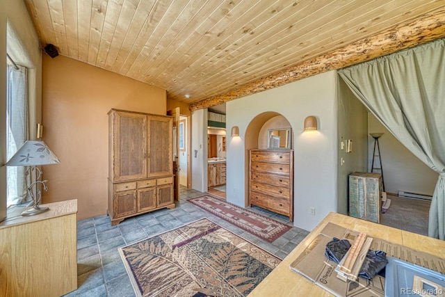 11855 County Road 251a, Salida, CO 81201 - bedroom with baseboard heating, wooden ceiling, ensuite bath, and arched walkways