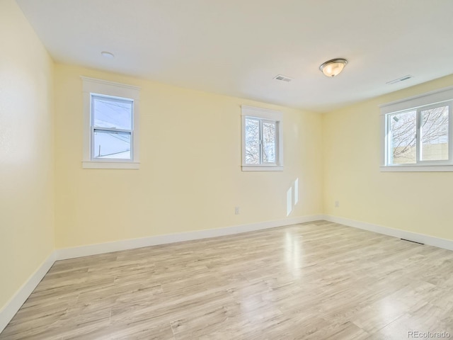 unfurnished room featuring light hardwood / wood-style flooring