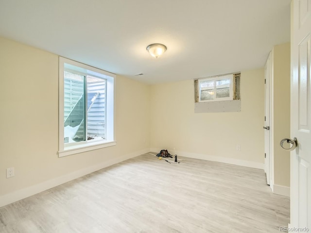 unfurnished room featuring light wood-type flooring