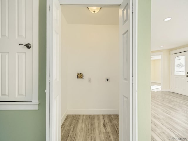 laundry area featuring light hardwood / wood-style floors and hookup for an electric dryer