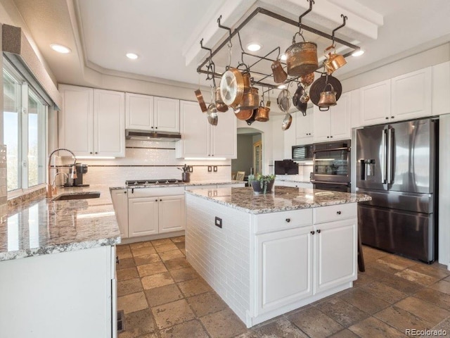 9531 Desert Willow Way, Highlands Ranch, CO 80129 - kitchen with appliances with stainless steel finishes, a sink, stone tile floors, tasteful backsplash, and recessed lighting