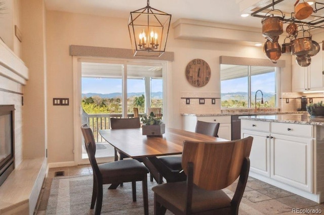 9531 Desert Willow Way, Highlands Ranch, CO 80129 - dining area with a chandelier