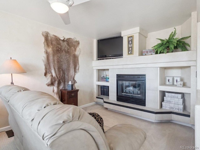 9531 Desert Willow Way, Highlands Ranch, CO 80129 - living room featuring carpet flooring, baseboards, a ceiling fan, and a tile fireplace