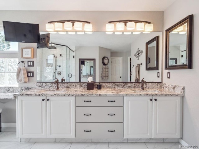 9531 Desert Willow Way, Highlands Ranch, CO 80129 - full bathroom featuring marble finish flooring, double vanity, a stall shower, and baseboards