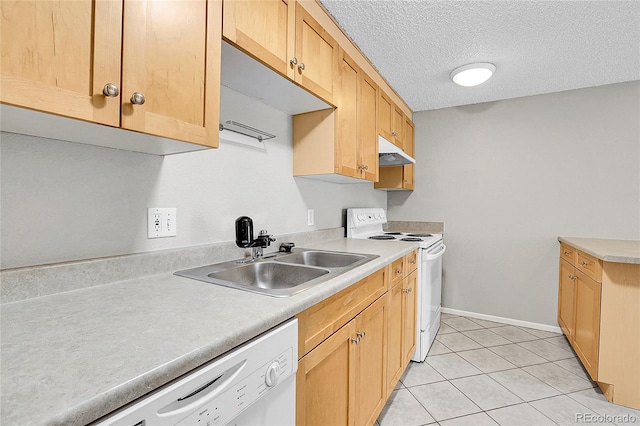 kitchen with light tile patterned flooring, light brown cabinetry, sink, white appliances, and a textured ceiling