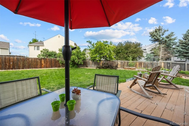 11100 Callaway Ct, Parker, CO 80138 - wooden deck with outdoor dining area and a fenced backyard