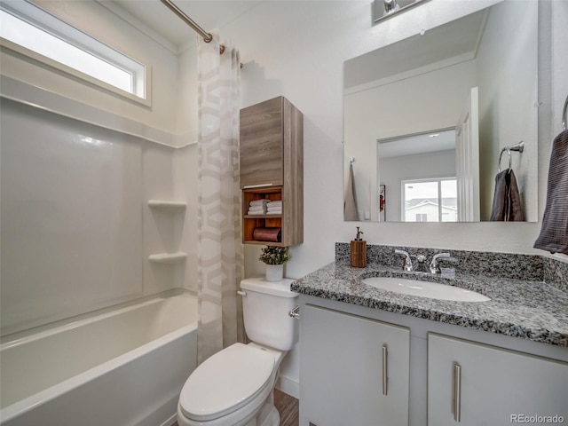 full bathroom with vanity, a wealth of natural light, shower / tub combination, and toilet