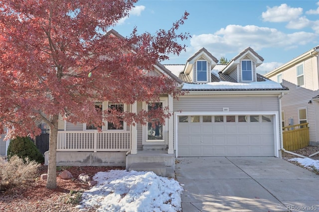 view of front of property with a porch and a garage