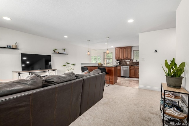 7579 Jay Ct, Arvada, CO 80003 - living area with recessed lighting, light colored carpet, and baseboards