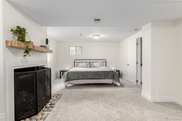 7579 Jay Ct, Arvada, CO 80003 - bedroom with a fireplace, carpet flooring, and baseboards