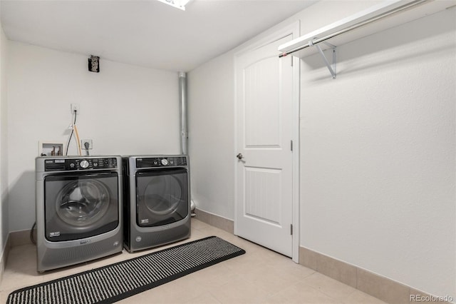 7579 Jay Ct, Arvada, CO 80003 - laundry room with washing machine and clothes dryer and baseboards