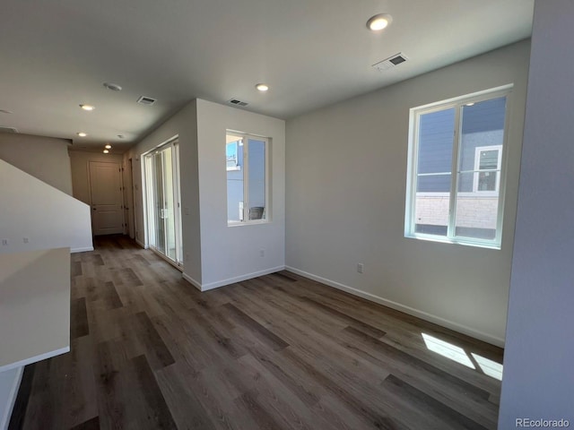 6658 N Nepal Ct, Aurora, CO 80019 - spare room featuring recessed lighting, baseboards, and wood finished floors