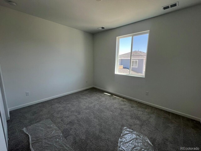 6658 N Nepal Ct, Aurora, CO 80019 - carpeted empty room featuring baseboards and a smoke detector