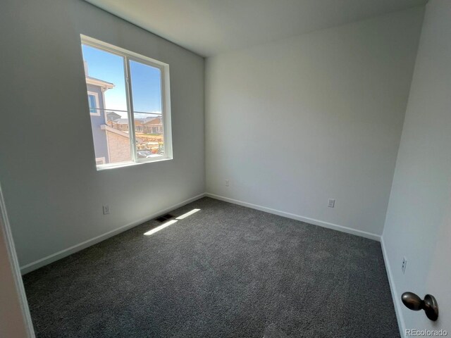 6658 N Nepal Ct, Aurora, CO 80019 - carpeted empty room with baseboards