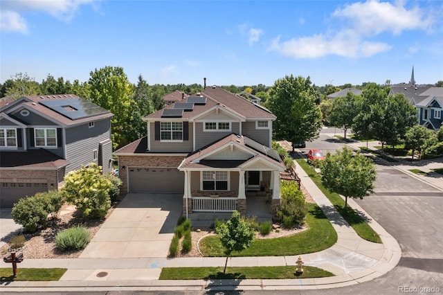 13322 Meadow Park Ln, Broomfield, CO 80020 - craftsman inspired home with covered porch, driveway, an attached garage, roof mounted solar panels, and stone siding
