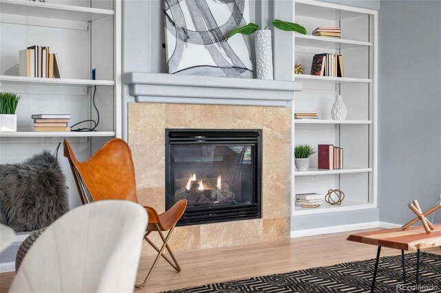 13322 Meadow Park Ln, Broomfield, CO 80020 - living area featuring wood finished floors and a tiled fireplace