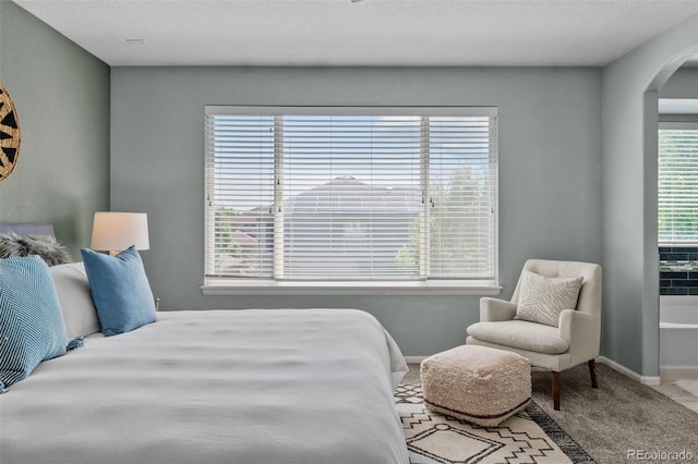 13322 Meadow Park Ln, Broomfield, CO 80020 - carpeted bedroom featuring arched walkways and baseboards