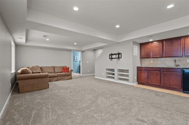 13322 Meadow Park Ln, Broomfield, CO 80020 - living area featuring a raised ceiling, bar with sink, light colored carpet, recessed lighting, and built in features