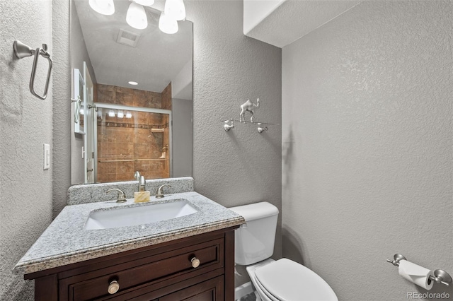 13322 Meadow Park Ln, Broomfield, CO 80020 - bathroom with vanity, a shower stall, and a textured wall