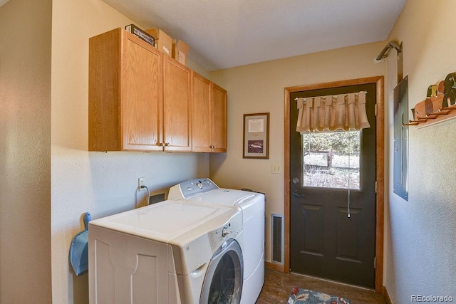 clothes washing area with cabinet space and washing machine and clothes dryer