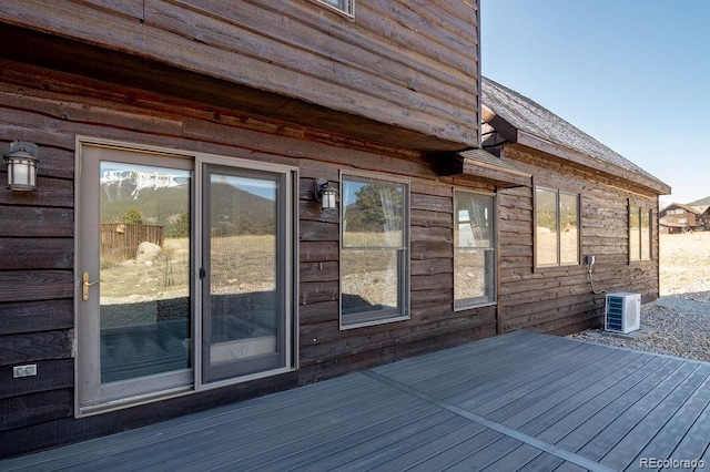 wooden deck with central air condition unit