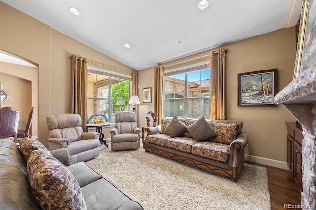 living room with wood finished floors, baseboards, vaulted ceiling, and recessed lighting