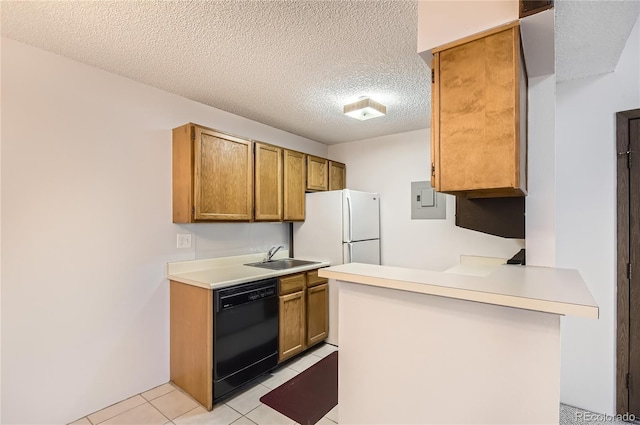 kitchen with sink, dishwasher, white refrigerator, a textured ceiling, and light tile patterned flooring