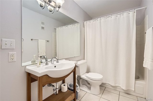 bathroom featuring tile patterned flooring, toilet, and shower / bath combo with shower curtain