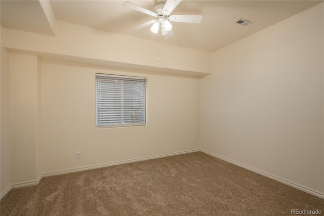 spare room with ceiling fan and carpet floors