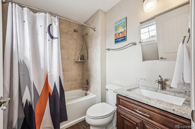 full bathroom featuring vanity, shower / bath combination with curtain, and toilet