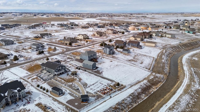 snowy aerial view featuring a residential view