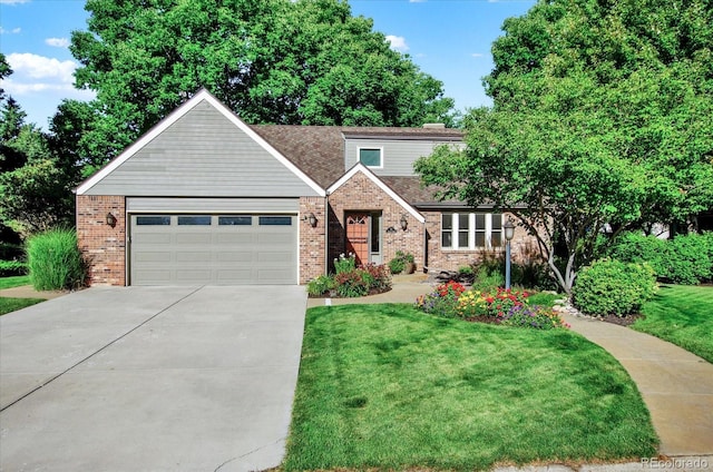 view of front of home with a front yard, brick siding, driveway, and an attached garage