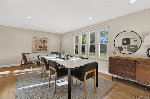 dining area with recessed lighting, wood finished floors, and baseboards