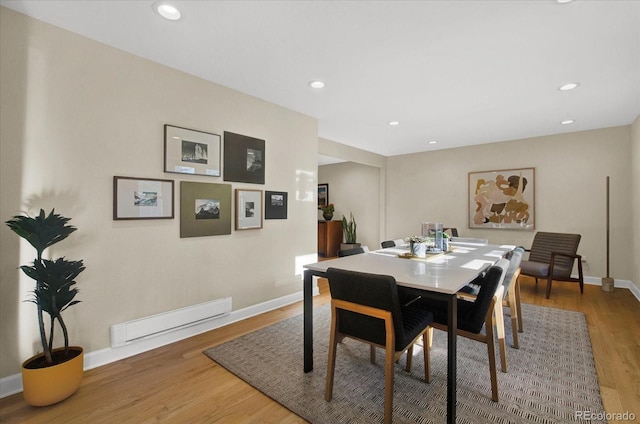 dining space with recessed lighting, wood finished floors, and baseboards