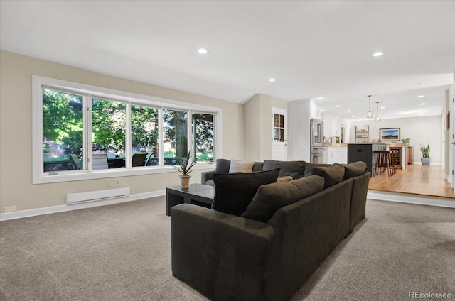 living area with baseboards, light colored carpet, and recessed lighting