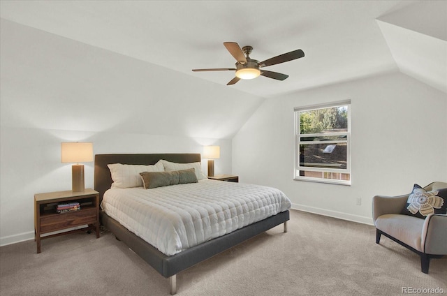 bedroom with carpet, baseboards, vaulted ceiling, and a ceiling fan