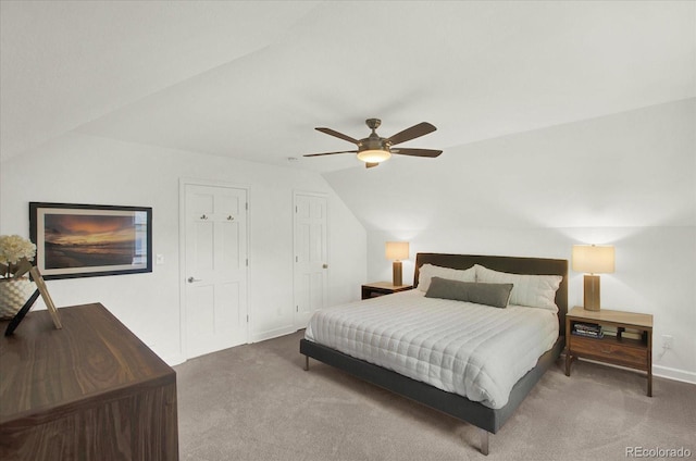 bedroom with ceiling fan, baseboards, vaulted ceiling, and carpet flooring