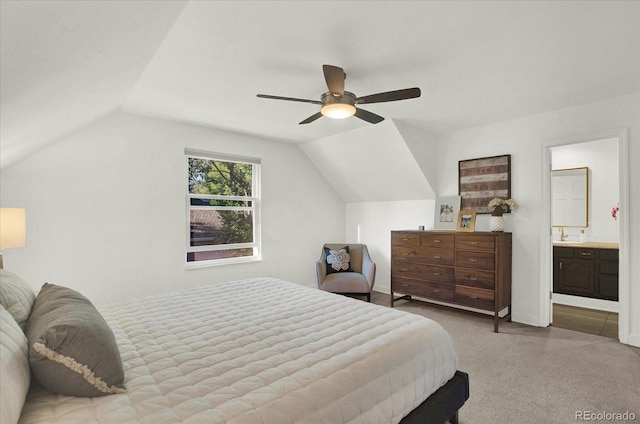 bedroom with baseboards, lofted ceiling, ensuite bath, ceiling fan, and carpet floors