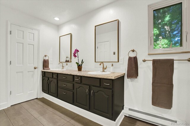 full bathroom featuring double vanity, a sink, and recessed lighting