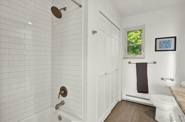 bathroom with shower / washtub combination, a baseboard radiator, toilet, vanity, and wood finished floors